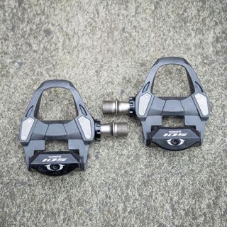 Pair of Shimano 105 clipless pedals on the ground 