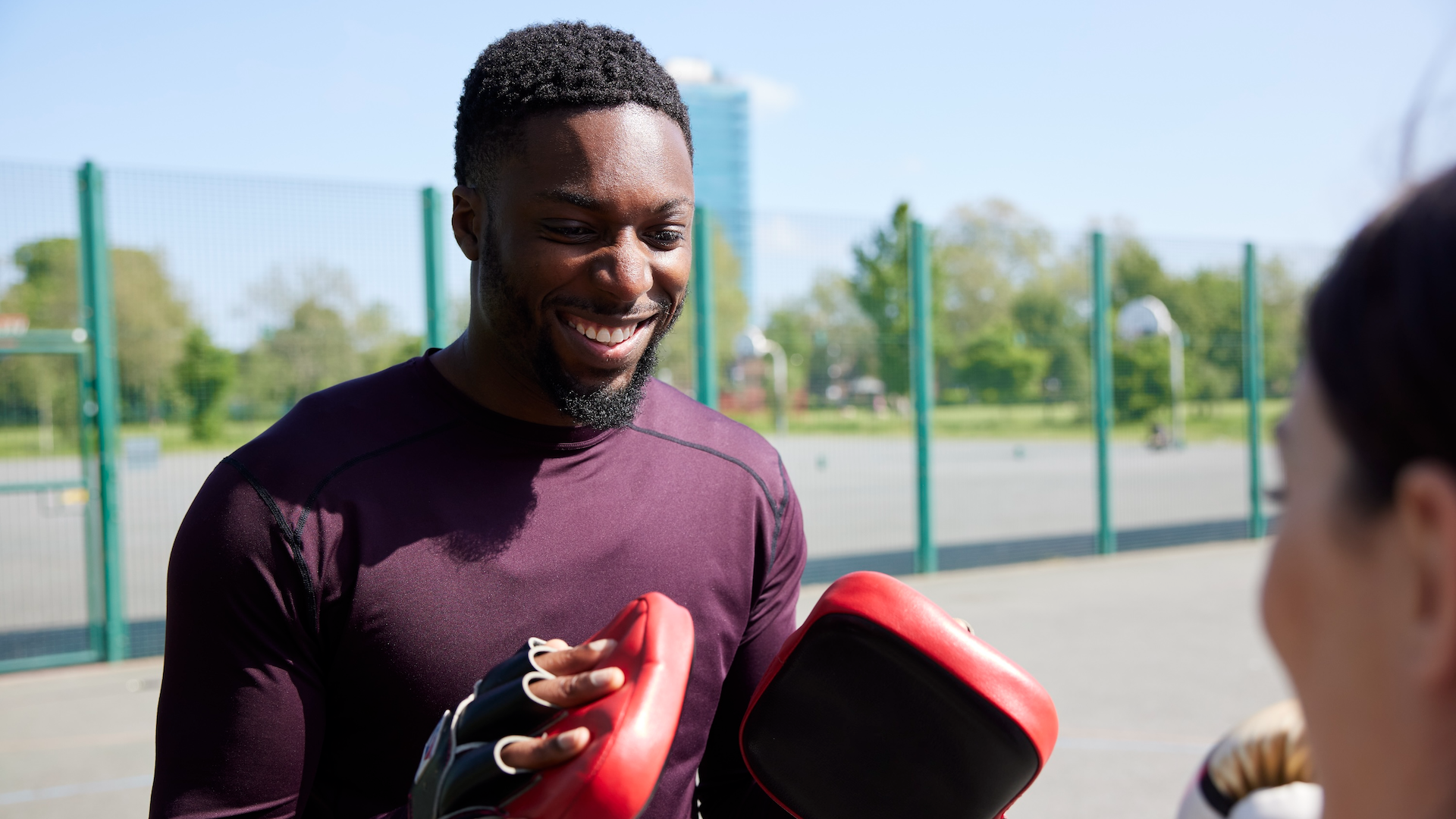 Woman boxing with a personal trainer