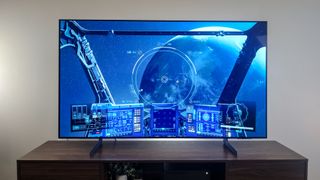 Samsung S85D OLED TV on stand in living room