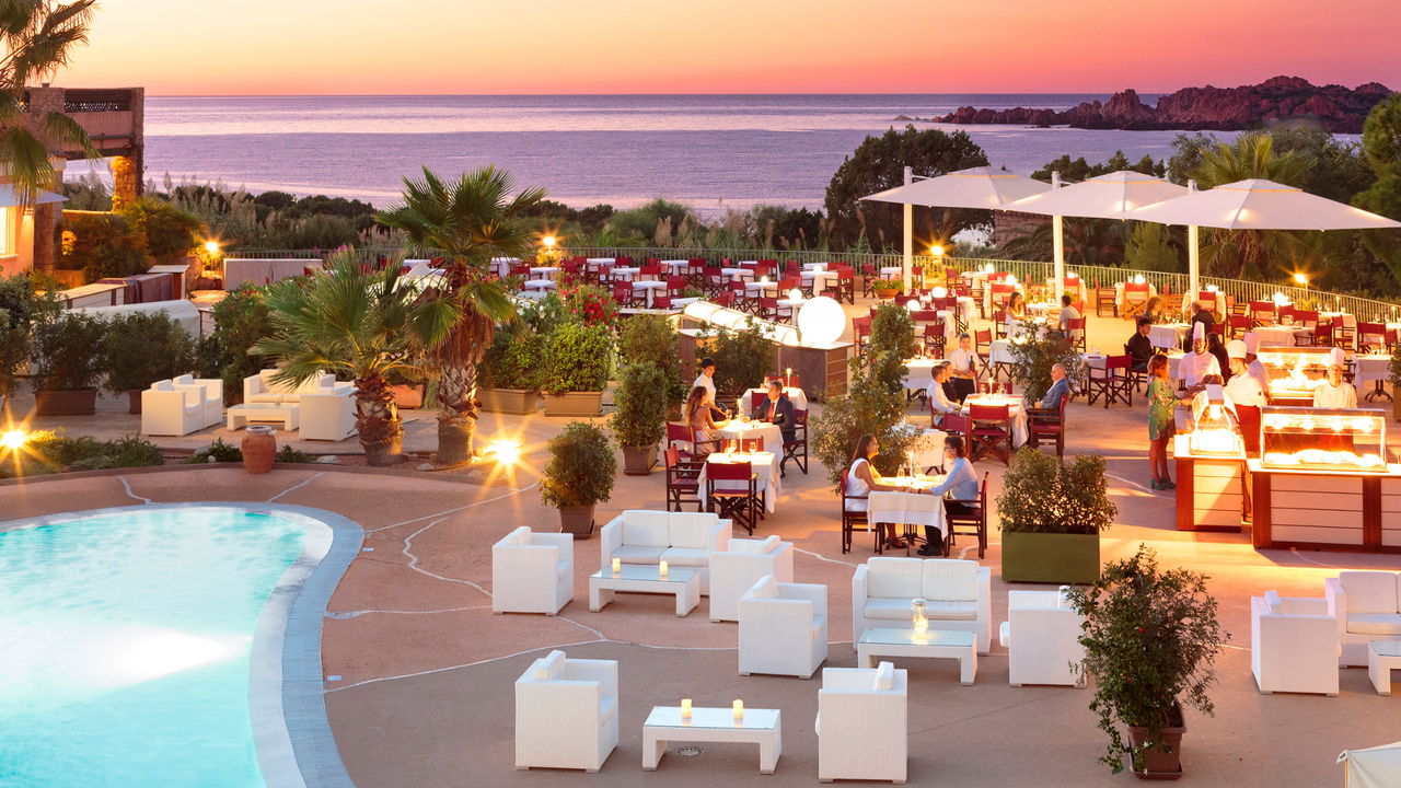 Sunset over the Punta Canneddi restaurant at La Marinedda Hotel, Sardinia