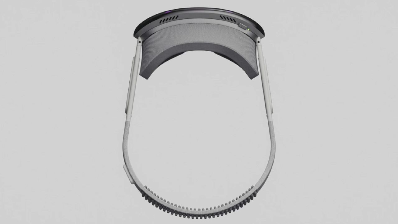 The Pimax Dream Air SE VR headset viewed from the top down, on a grey background