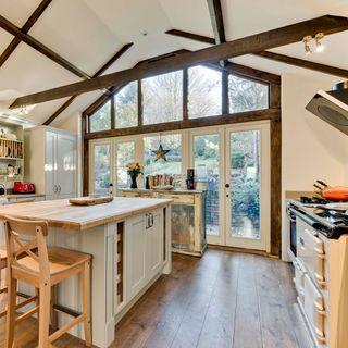 kitchen area with wooden beams and cookpot