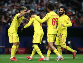 Naby Keita (second left) celebrates his goal for Liverpool