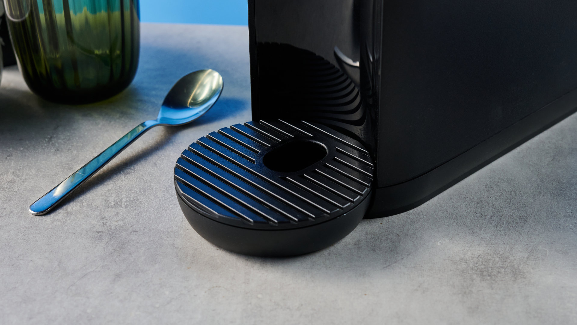 the keurig k-mini mate coffee maker photographed with the blue tom's guide background