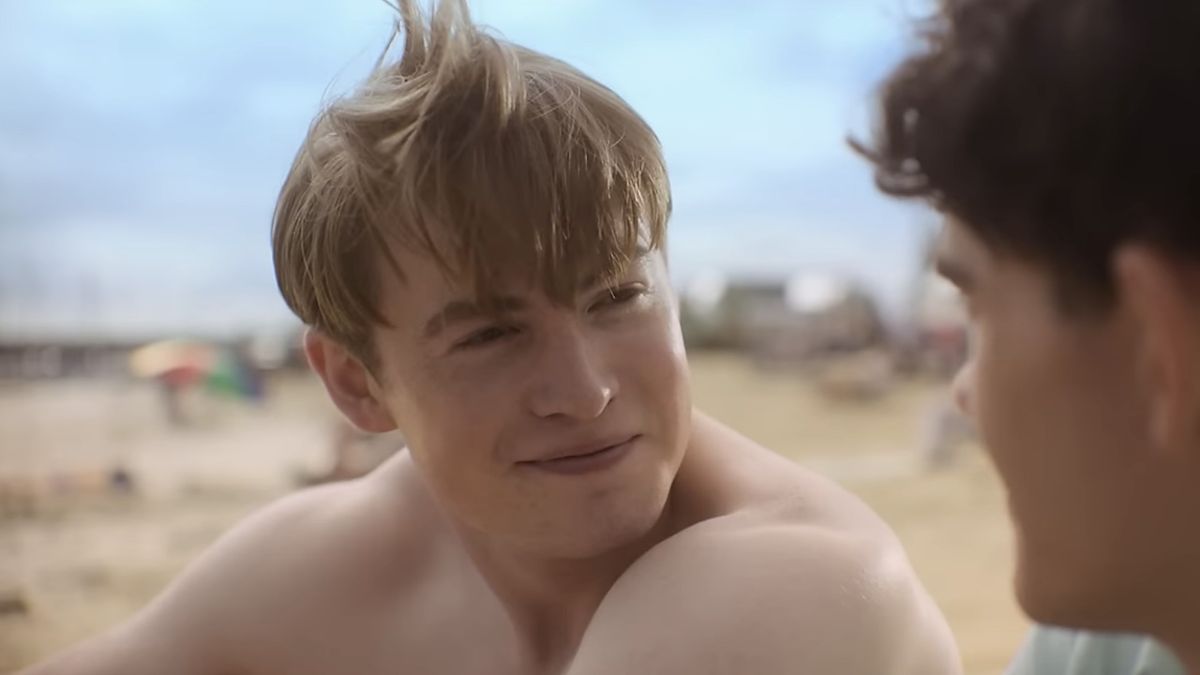 Nick smiling at Charlie on the beach in Heartstopper Season 3