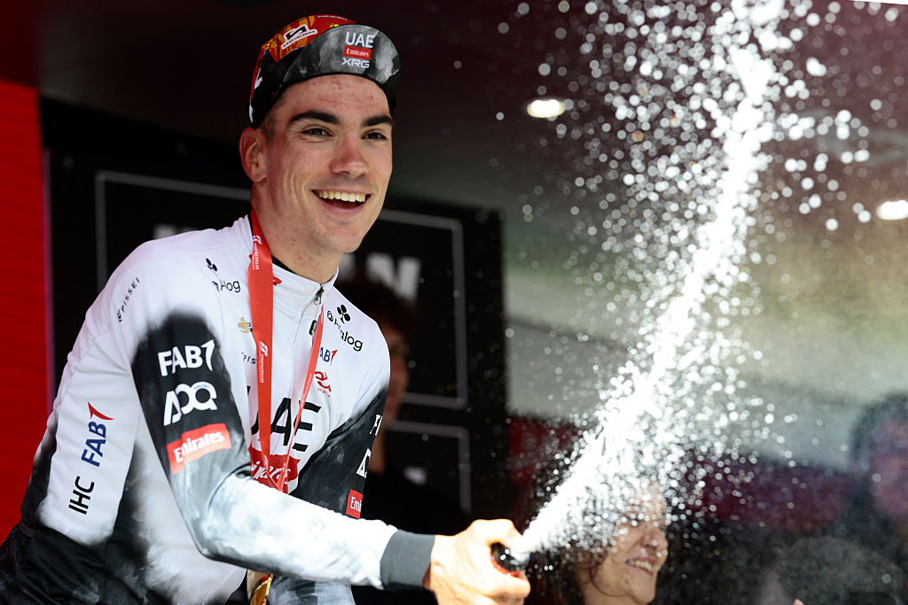 UAE Team Emirates XRG's Spanish rider Juan Ayuso celebrates on the podium after victory in the 7th stage of the 108th Giro d'Italia cycling race 168kms from Castel di Sangro to Tagliacozzo on May 16, 2025. (Photo by Luca Bettini / AFP)