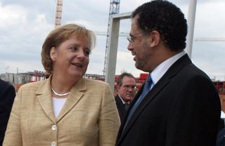 World Cup 2010 organising committee CEO Danny Jordan chats to German Chancellor Angela Merkel in 2007.