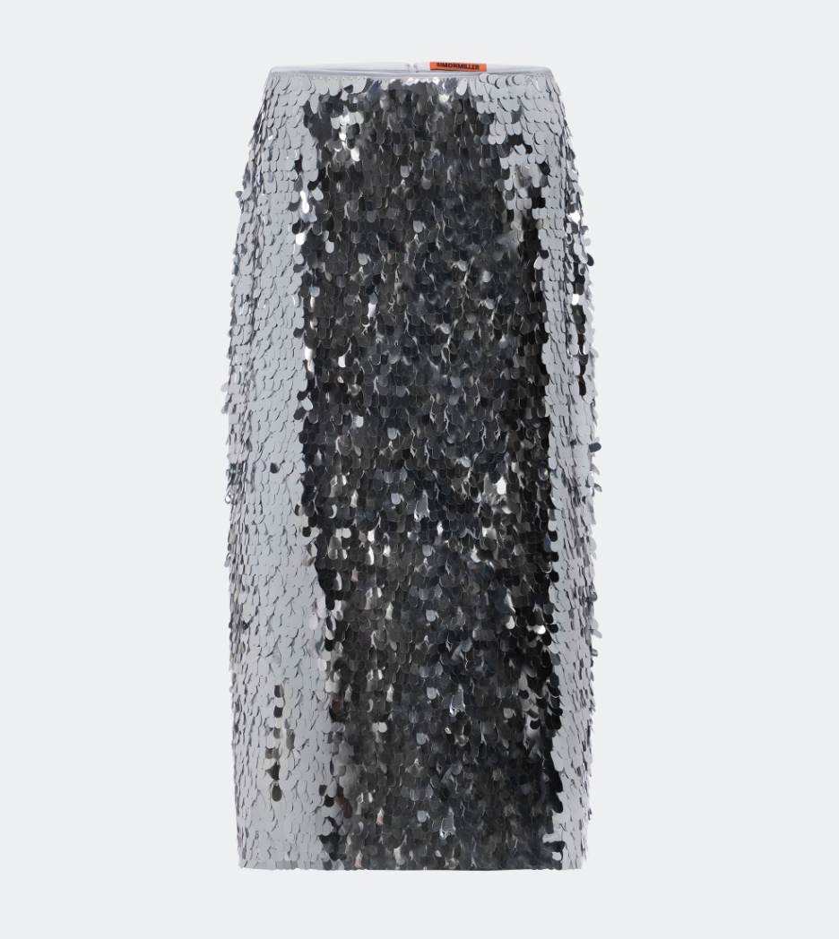a sequin skirt in front of a plain backdrop