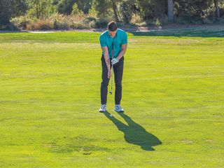 Gary Munro demonstrating grip position for an 80-yard pitch shot