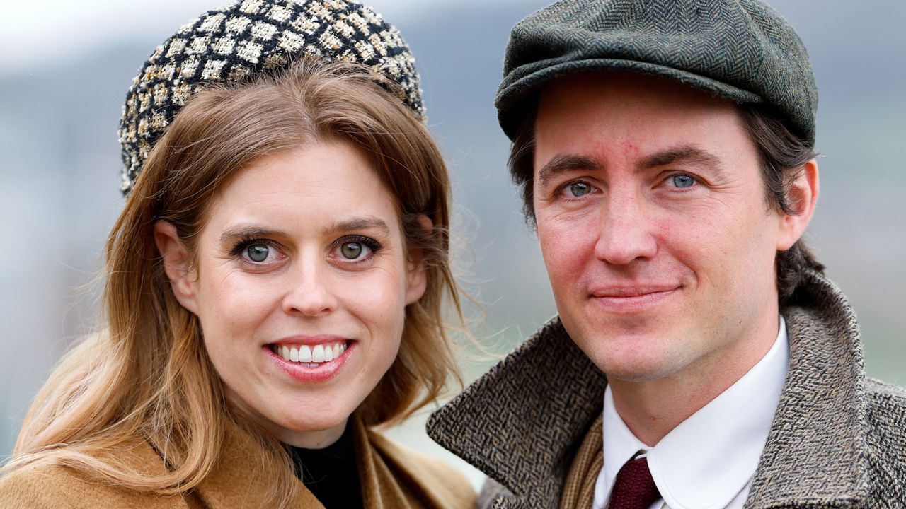 Princess Beatrice and Edoardo Mapelli Mozzi smiling at the camera and wearing wool coats