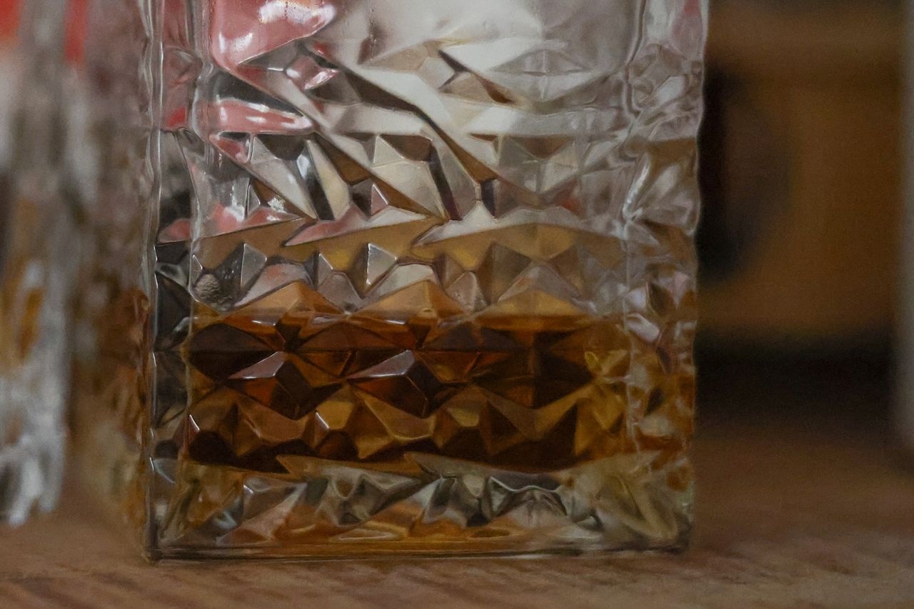 An image of a whisky decanter cropped to zoom in close