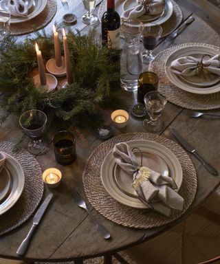 Thanksgiving centerpiece ideas with pine wreath filled with candles