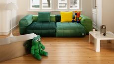 Vetsak x Aspesi Transformation green sofa and bright cushions