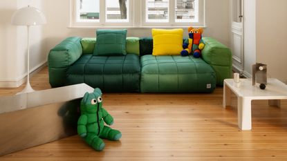 Vetsak x Aspesi Transformation green sofa and bright cushions