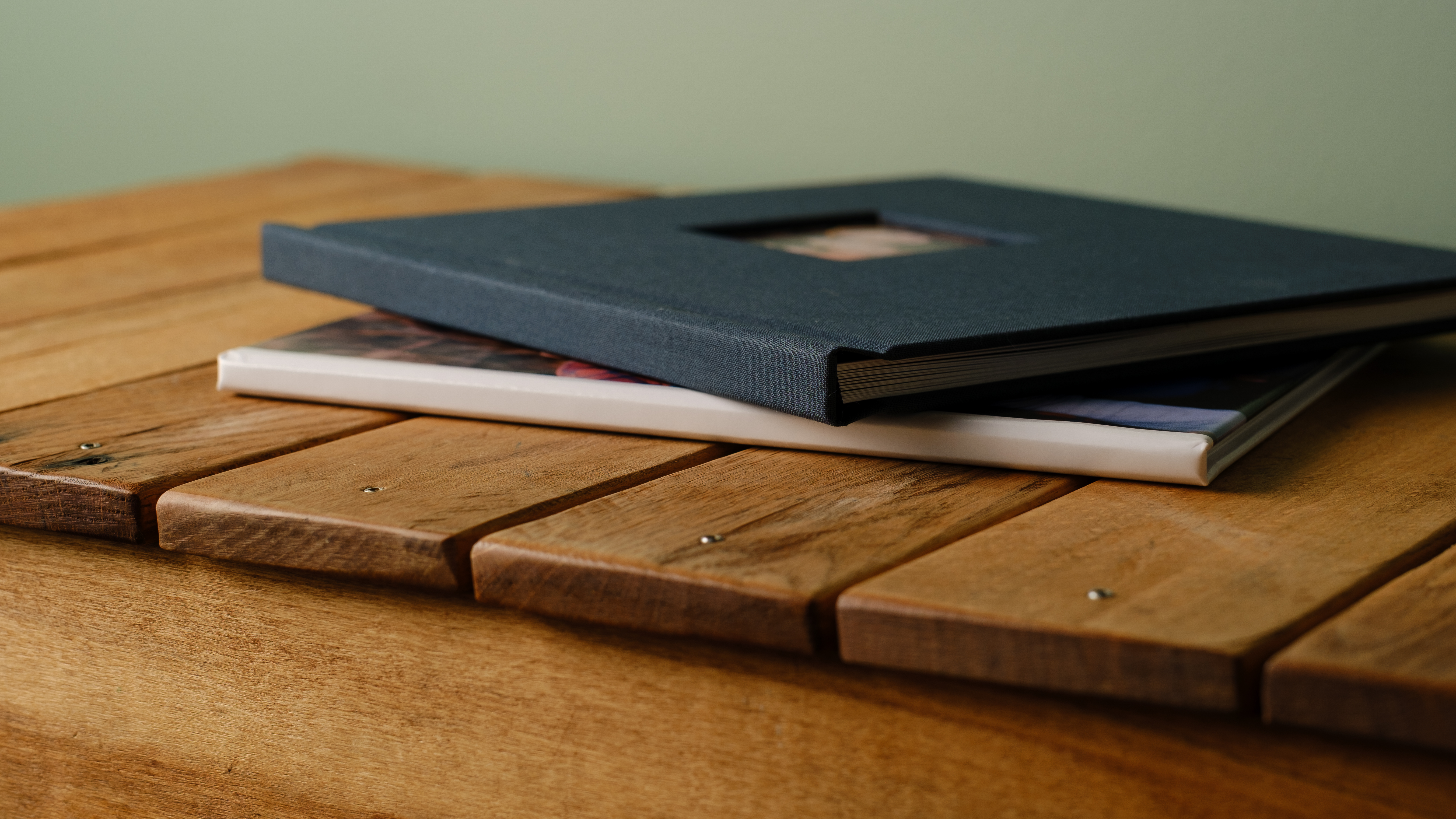 Photo books from Printique on a desktop