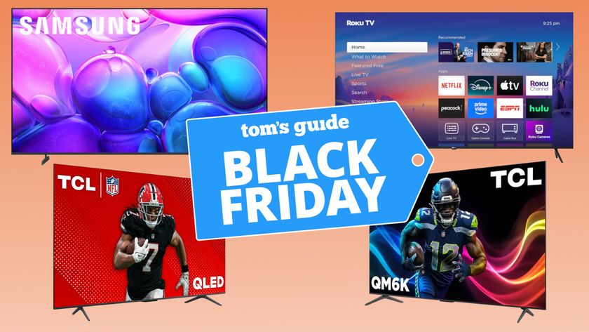 Several TVs arranged into quadrants in front of a colorful background