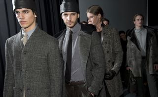 Men in dark Armani suits