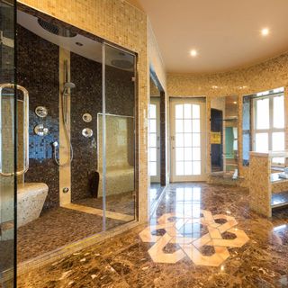 room with tiles glass door and shower