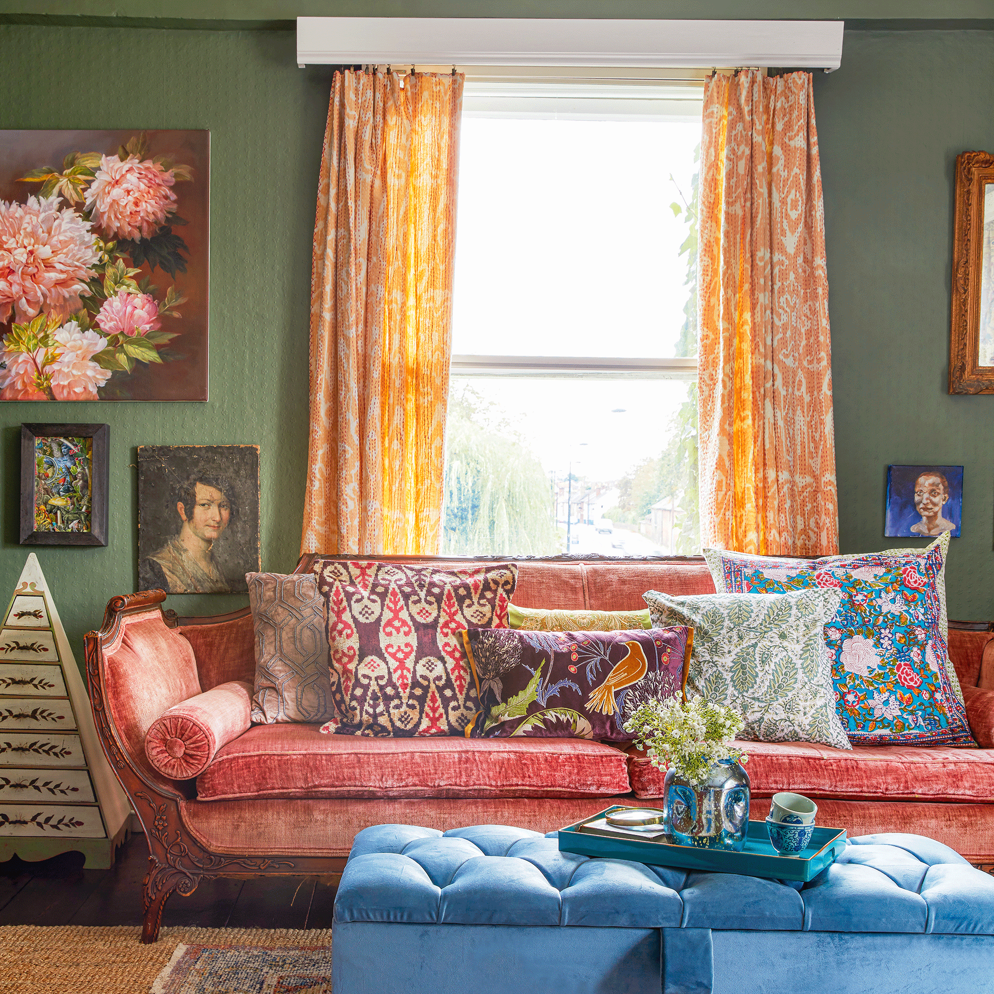 Green living room with orange curtains