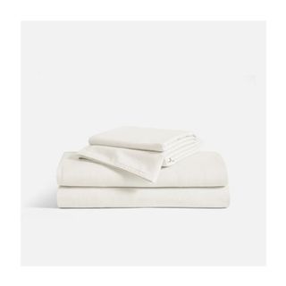 cream folded bedsheets
