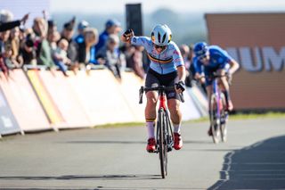 Fleur Moors (Belgium) celebrates her European road title victory ahead of Federica Venturelli