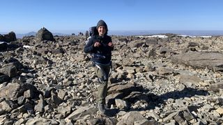 Julia Clarke at Ben Nevis summit wearing Hypershell exoskeleton