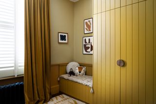 a kids room with yellow velvet curtains