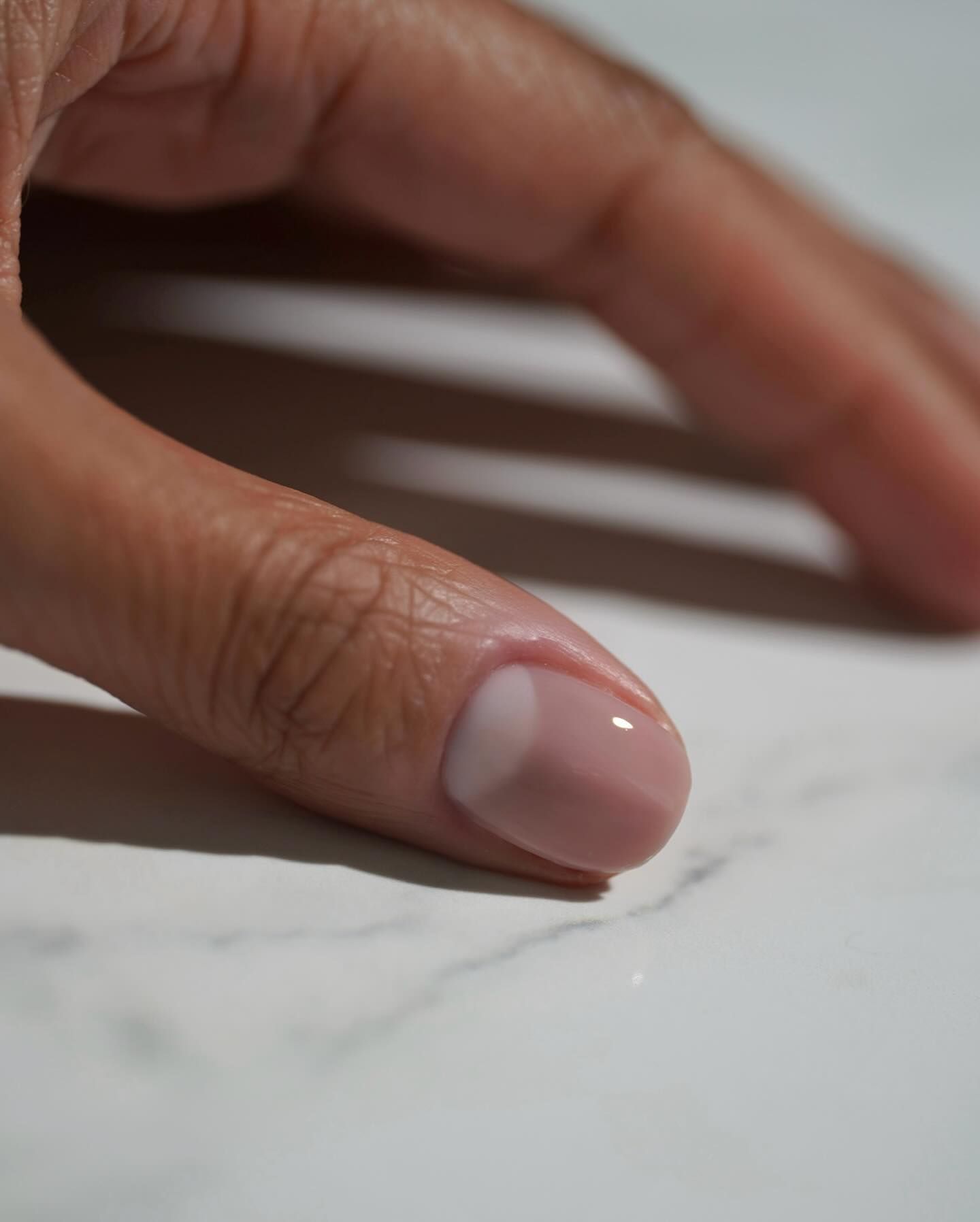 @iramshelton wearing OPI Funny Bunny and Put it in Neutral on her nails