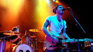  Brian Fallon (R) of Gaslight Anthem performs in support of The '59 Sound release at the San Jose State Event Center on November 7, 2008 in San Jose, California.