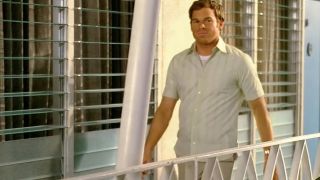 Michael C. Hall as Dexter walking outside of his apartment