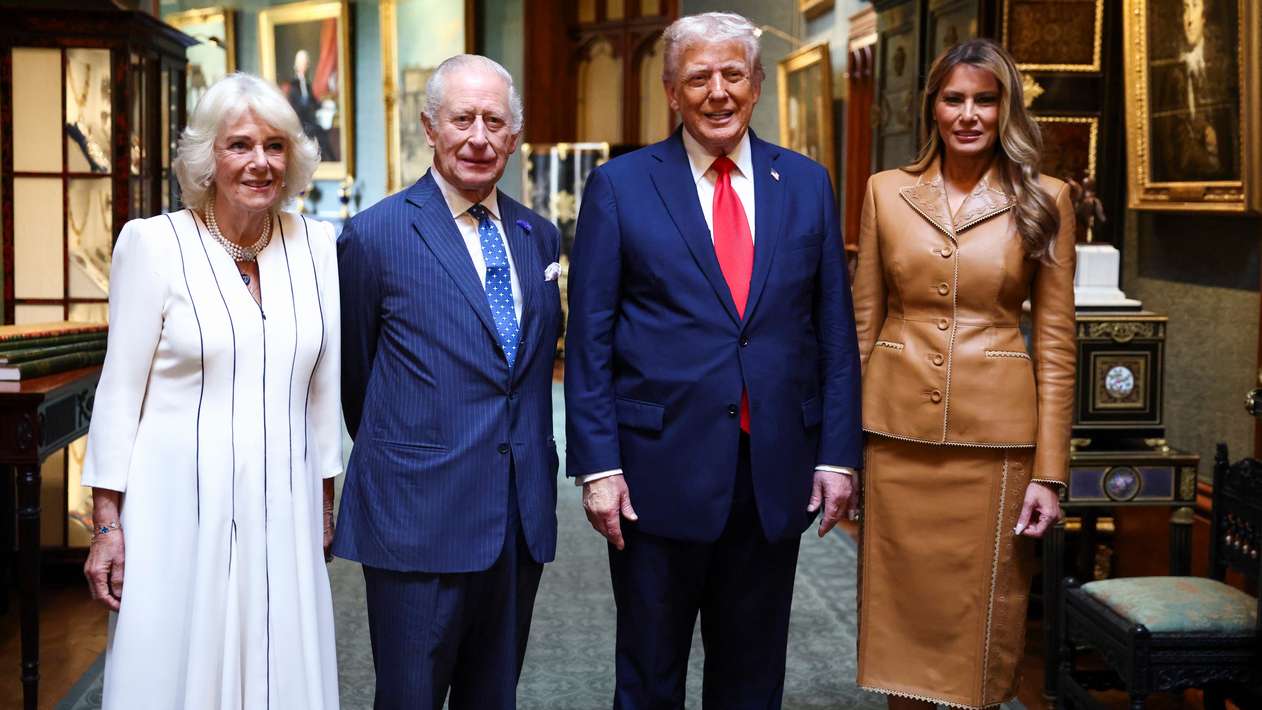 U.S. President Donald Trump and first lady Melania Trump pose with King Charles and Queen Camilla as they bid their farewells at Windsor Castle during a state visit on September 18, 2025