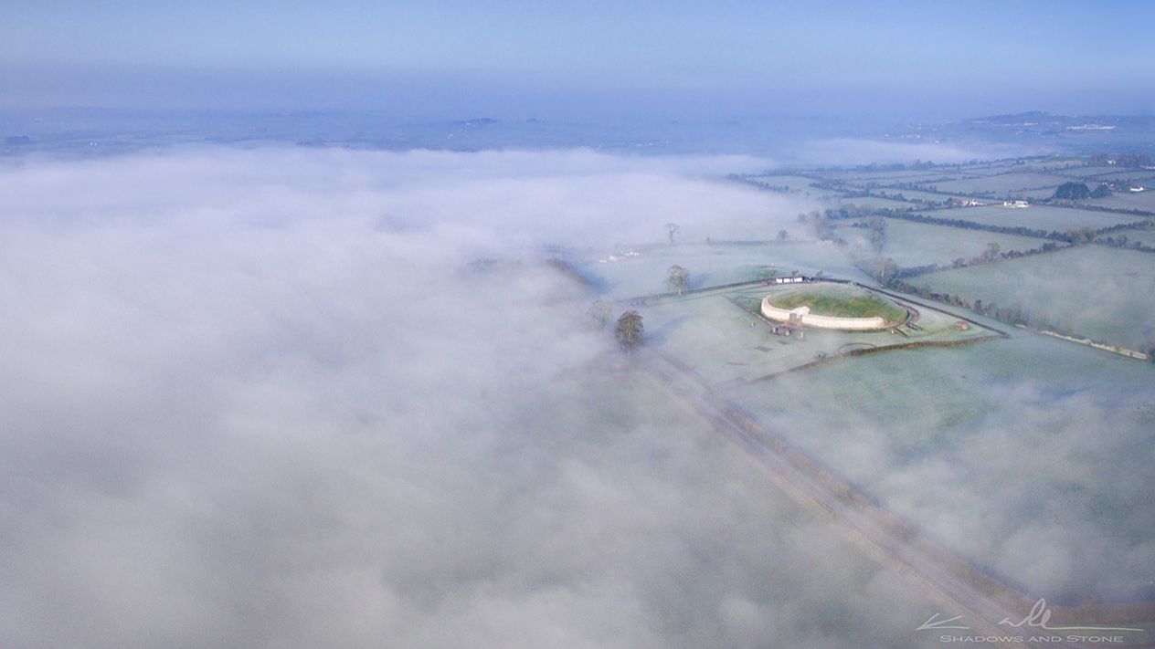 The circular Newgrange passage tomb on a misty morning in Ireland's Boyne Valley. Scientists say it contained the bones of a Neolithic man, probably a king whose parents were brother and sister.