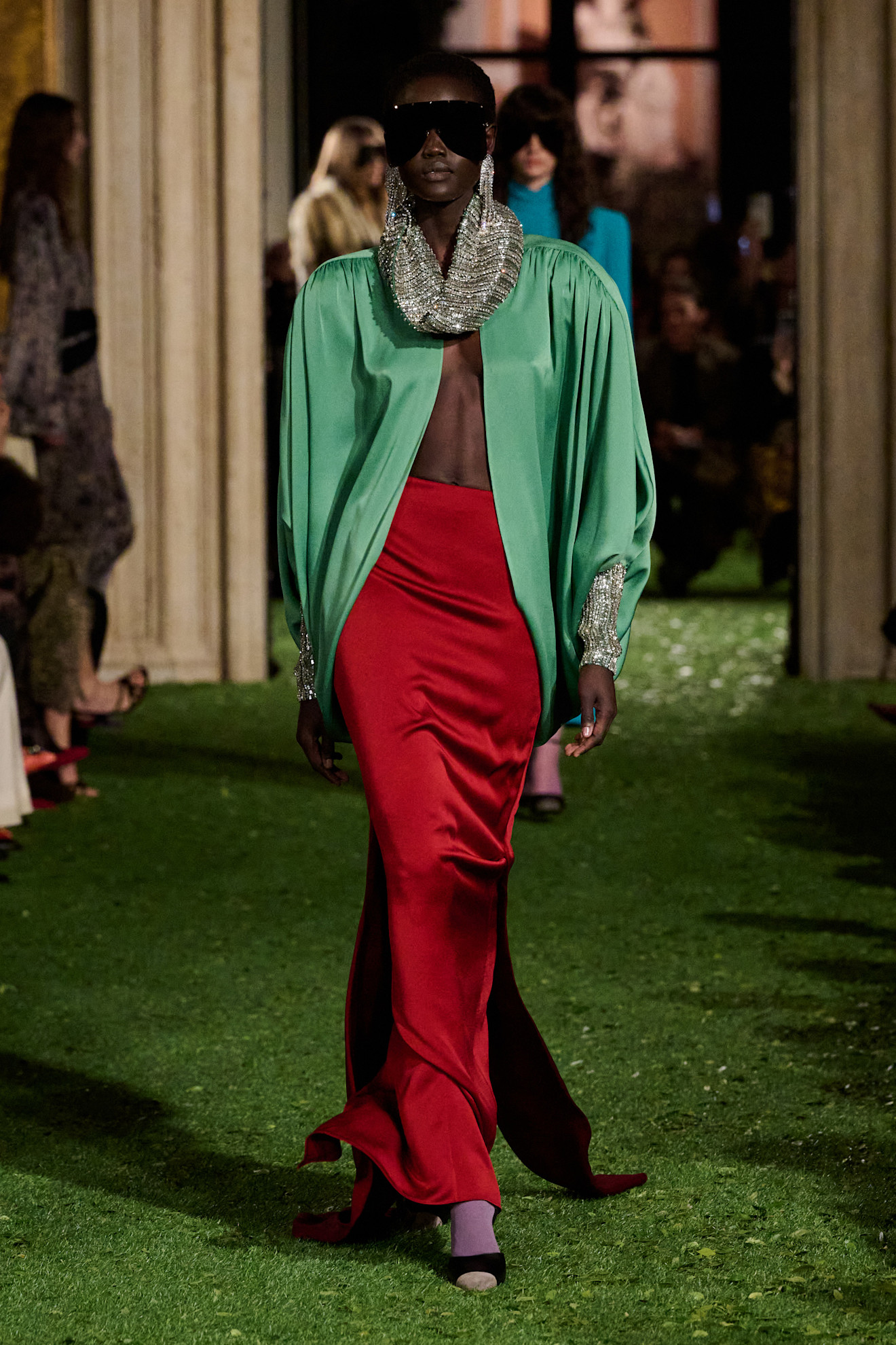 A model wore the mint green and red color combination trend on the Fall 2026 runway