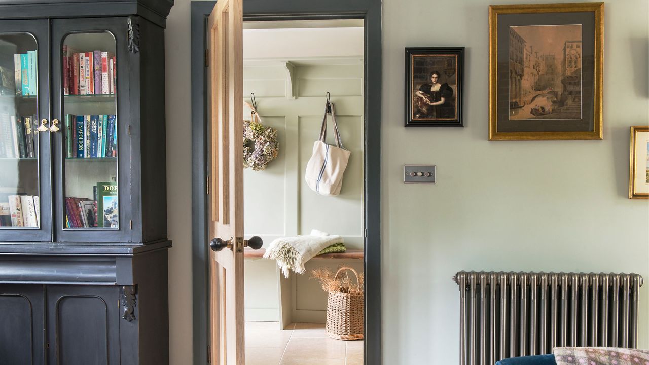 wooden internal door from the living room to the hallway. The doorframe has been painted in a contrasting colour