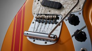 Close up of the tremolo system on a Fender Mustang