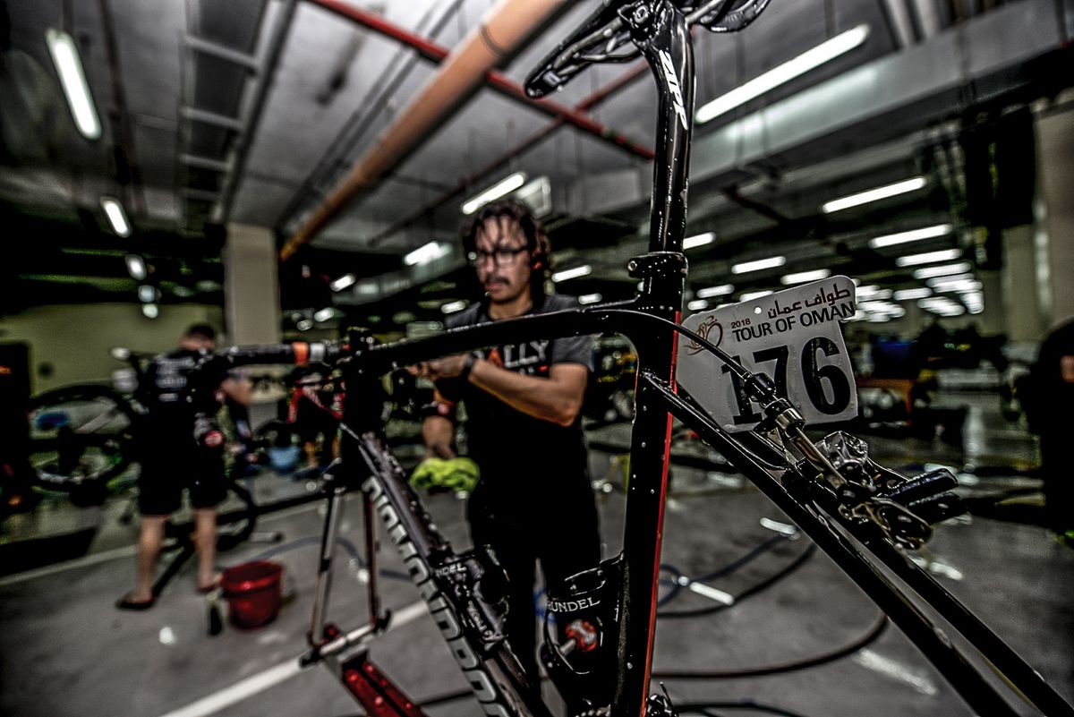 Brandon McNulty's bike gets a once over from Erik in the basement of the swanky Hormuz Grand outside Muscat.