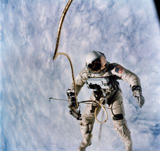 Astronaut Edward H. White, who piloted the Gemini IV spaceflight, floats in space during the first spacewalk by an American.