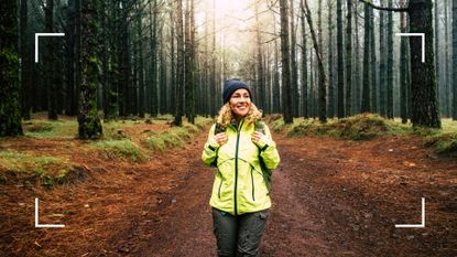 Woman walking through forest