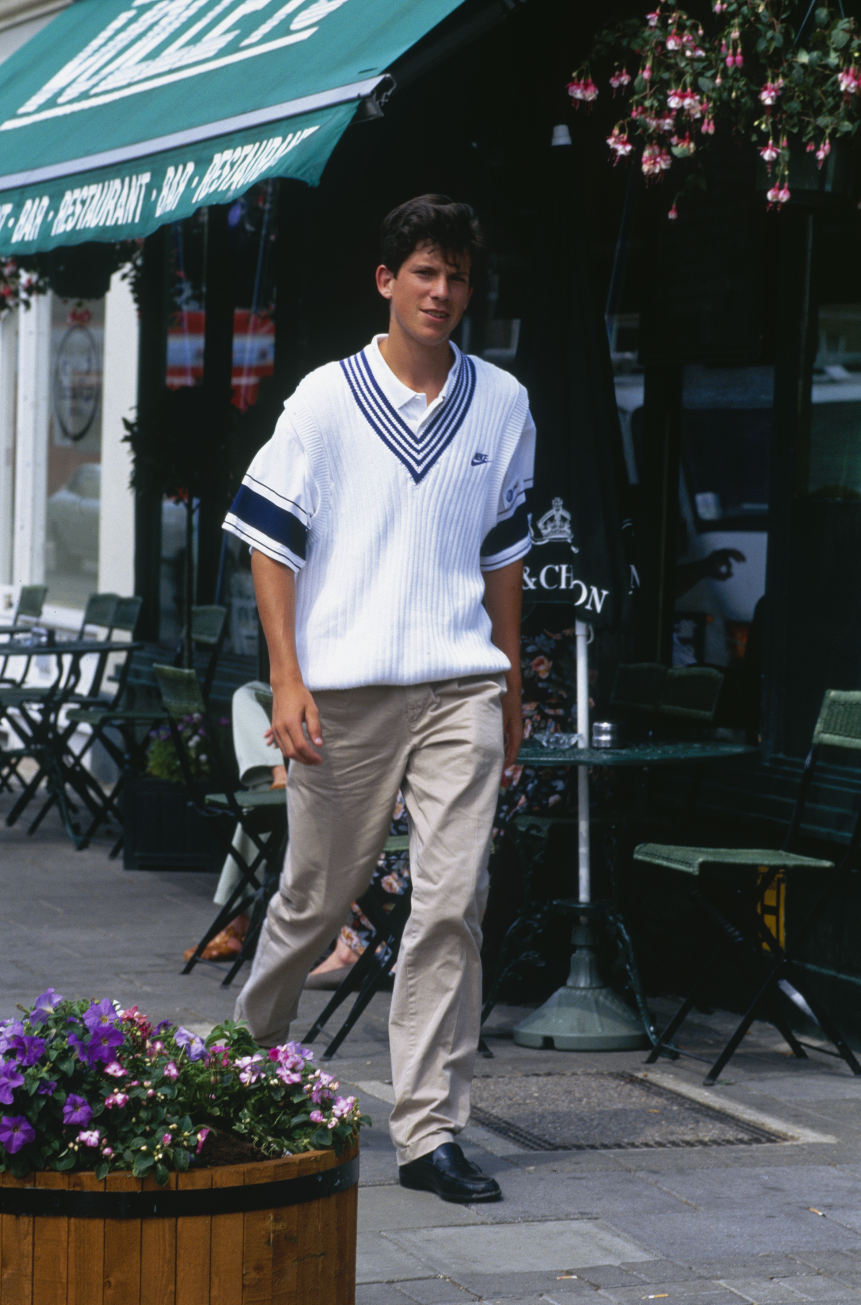 Tim Henman wearing a varsity sweater at Wimbledon.
