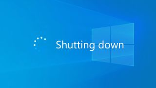 Windows 10 shutting down message overlayed with Windows 10 default wallpaper.