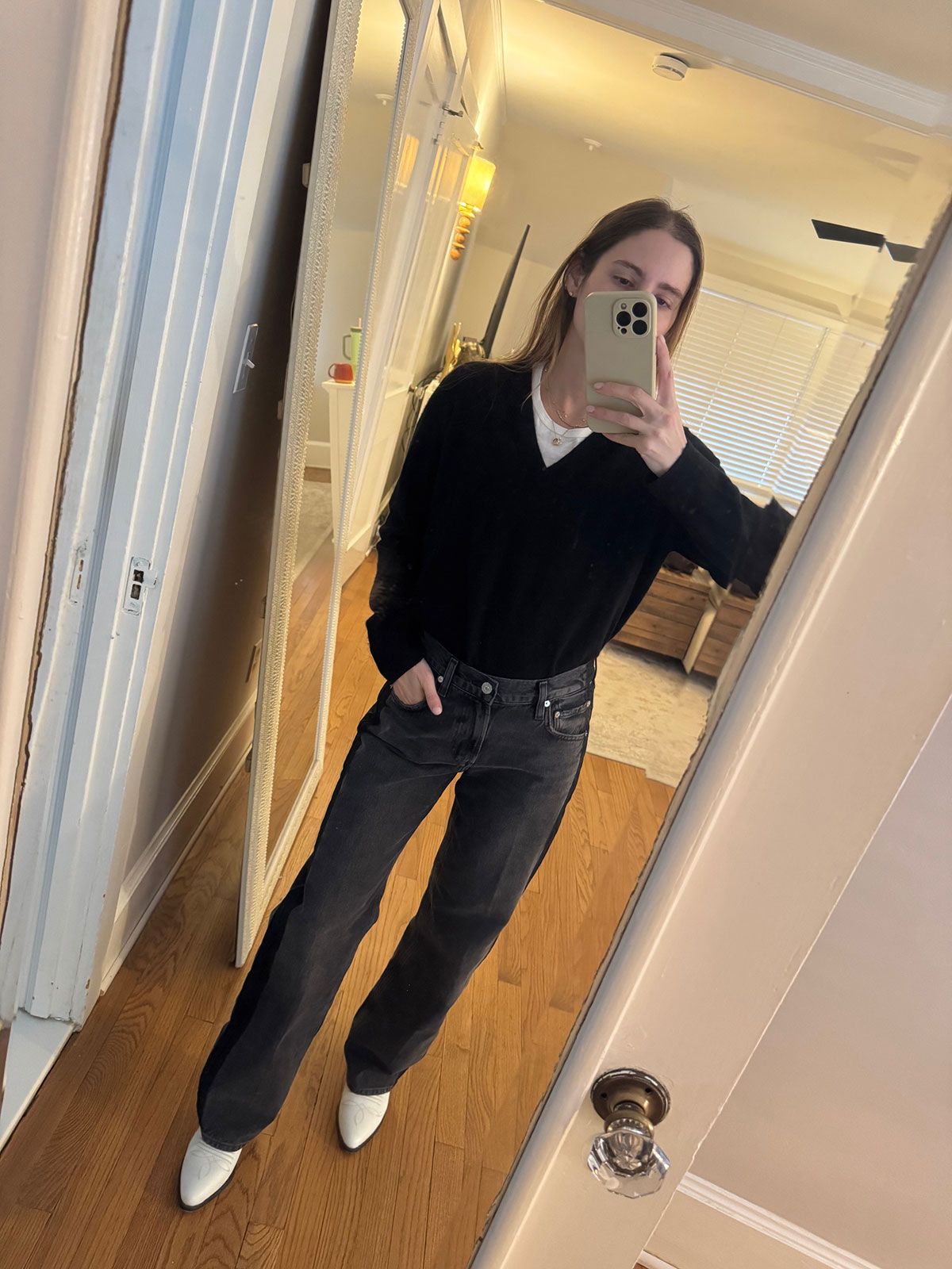 Tessa Faye O'Connell wearing a V-neck sweater.