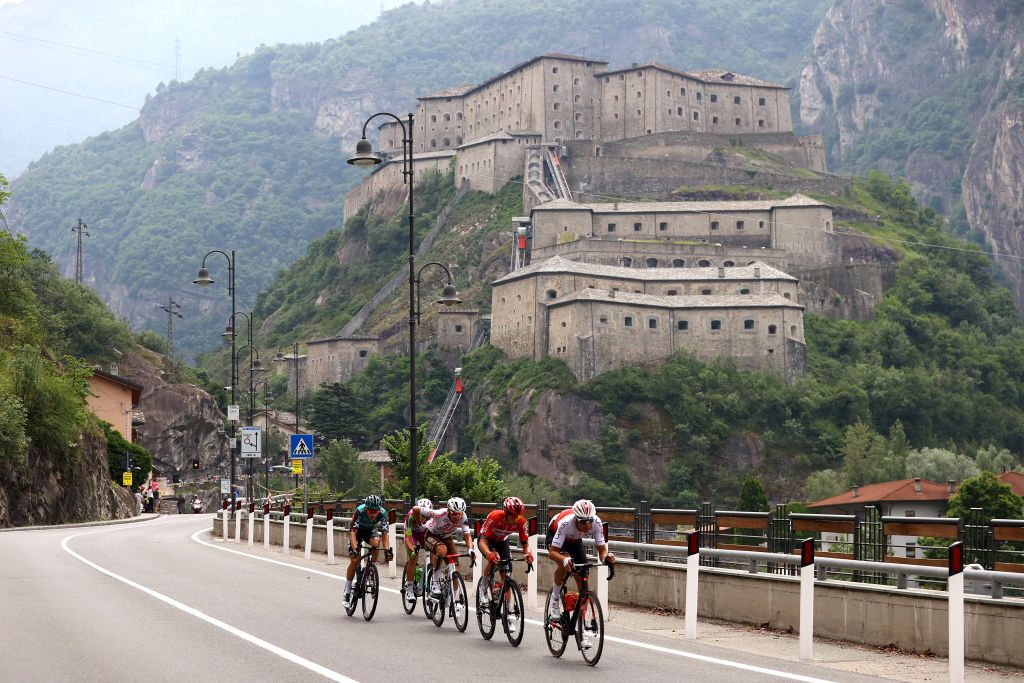 COGNE ITALY MAY 22 Andrea Vendrame of Italy and AG2R Citroen Team Alessandro Tonelli of Italy and Team Bardiani CSF Faizane Lennard Kmna of Germany and Team Bora Hansgrohe Anthony Perez of France and Team Cofidis and Sylvain Moniquet of Belgium and Team Lotto Soudal compete in the breakaway passing in front of the Bard Fort 400m in the Aosta Valley during the 105th Giro dItalia 2022 Stage 15 a 177km stage from Rivarolo Canavese to Cogne 1622m Giro WorldTour on May 22 2022 in Cogne Italy Photo by Michael SteeleGetty Images