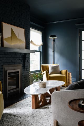 A living room drenched in blue paint
