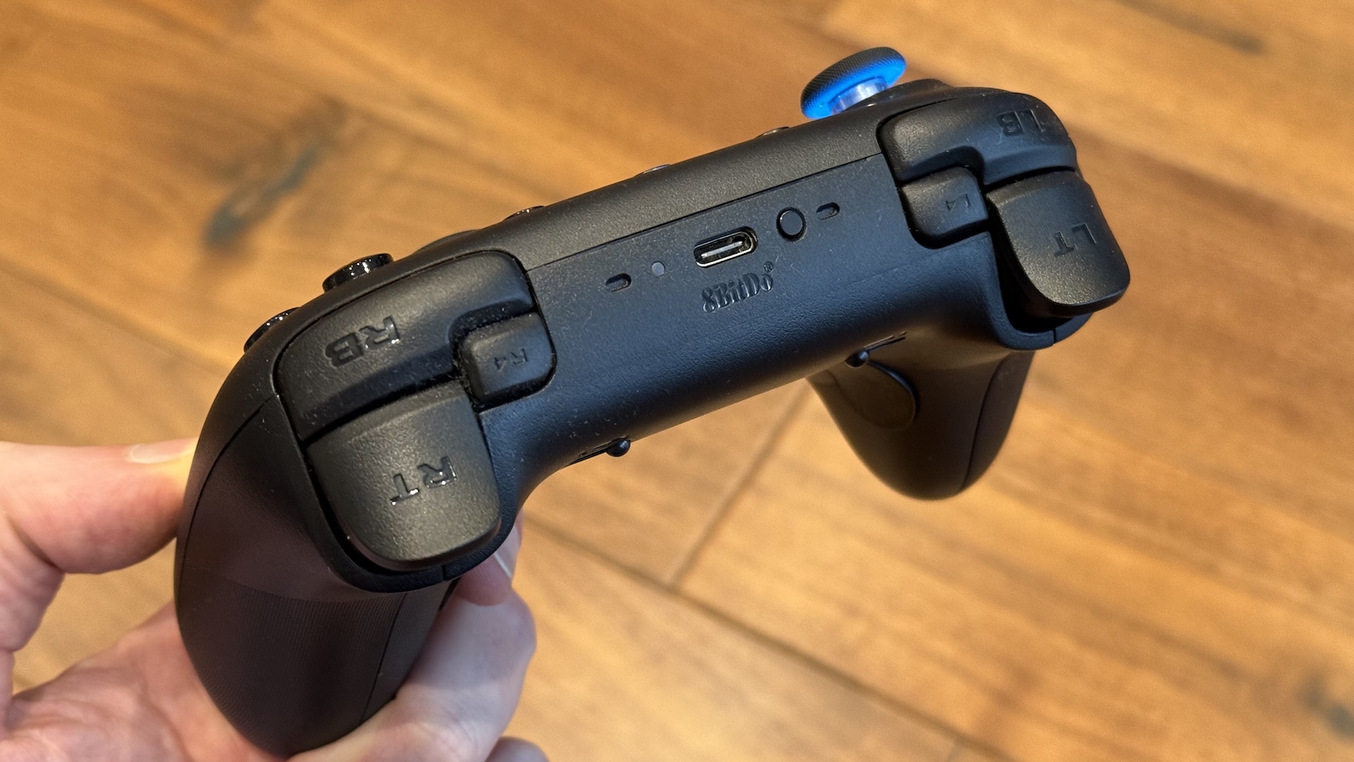 The 8BitDo Ultimate 2 controller, with dock and USB connection at home