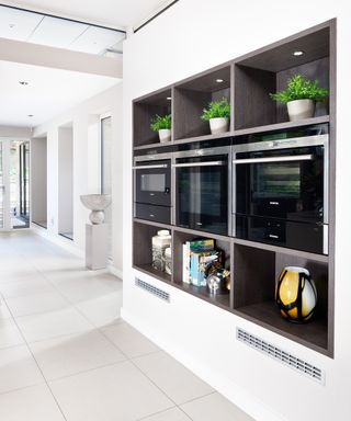 Kitchen with bank of eye level appliances