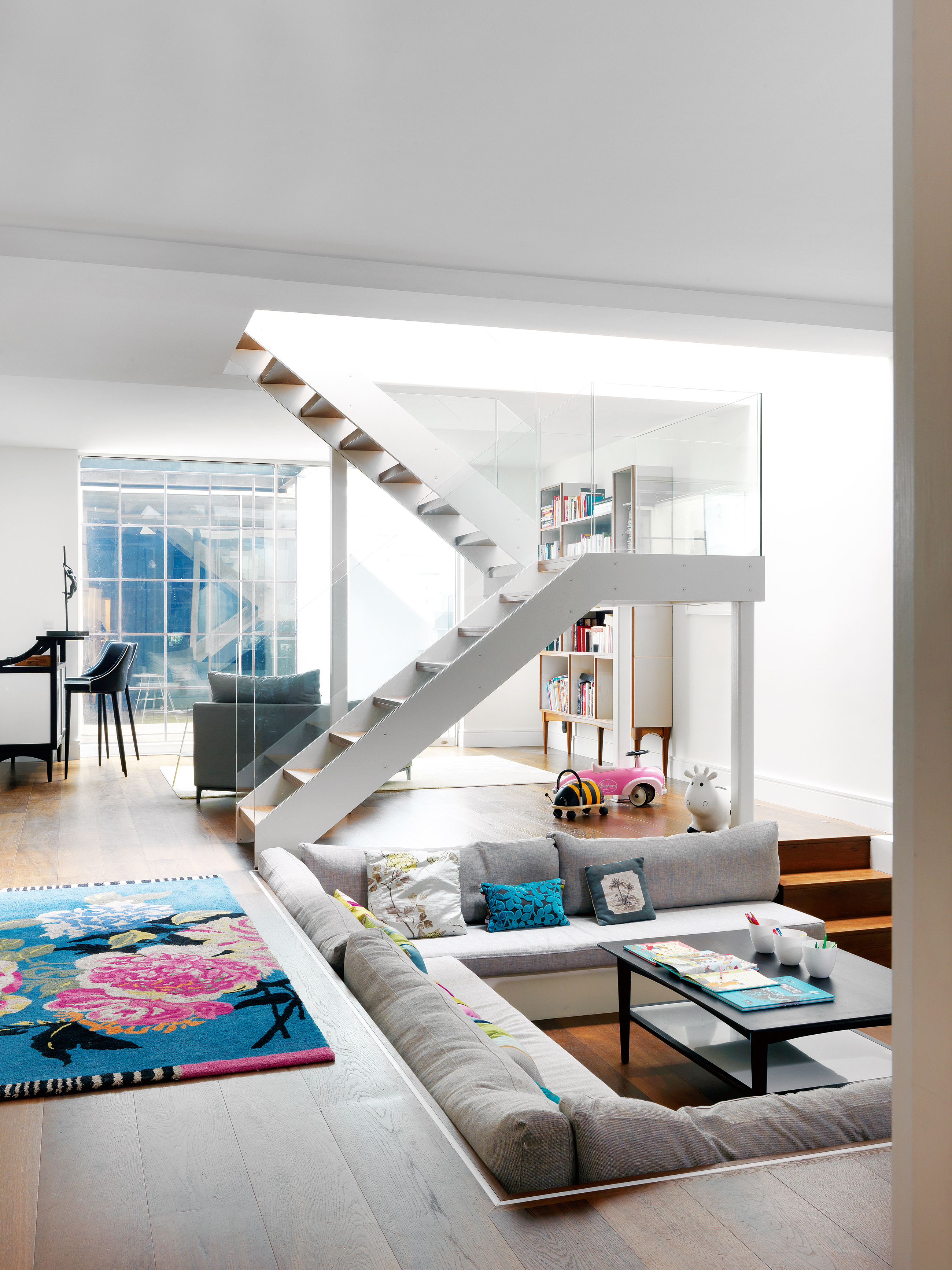 Sunken living room in a basement open plan space