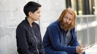A still from the Devs TV show in which Sonoya Mizuno and Nick Offerman are talking.