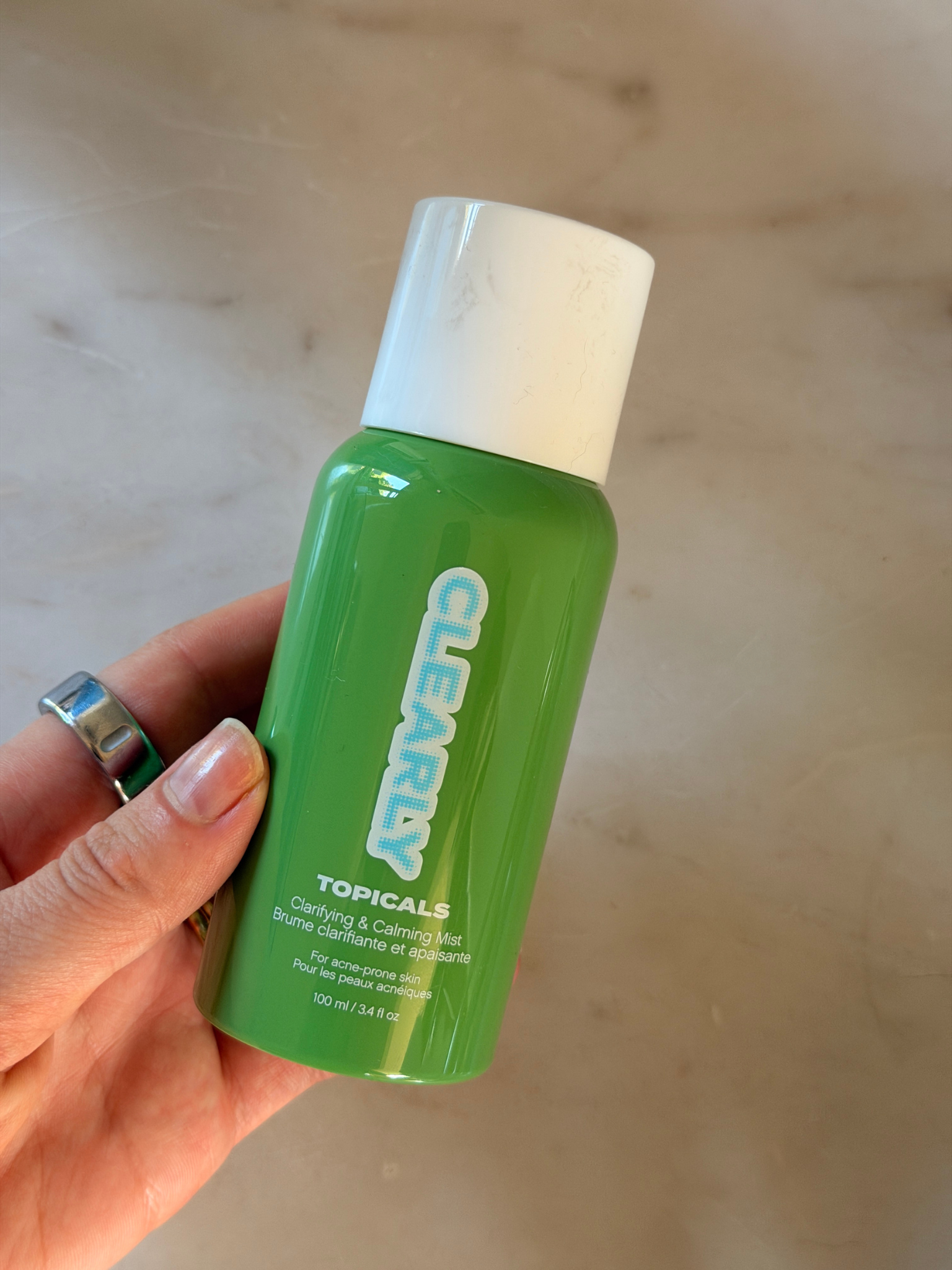 Grace Day holding the Topicals spray