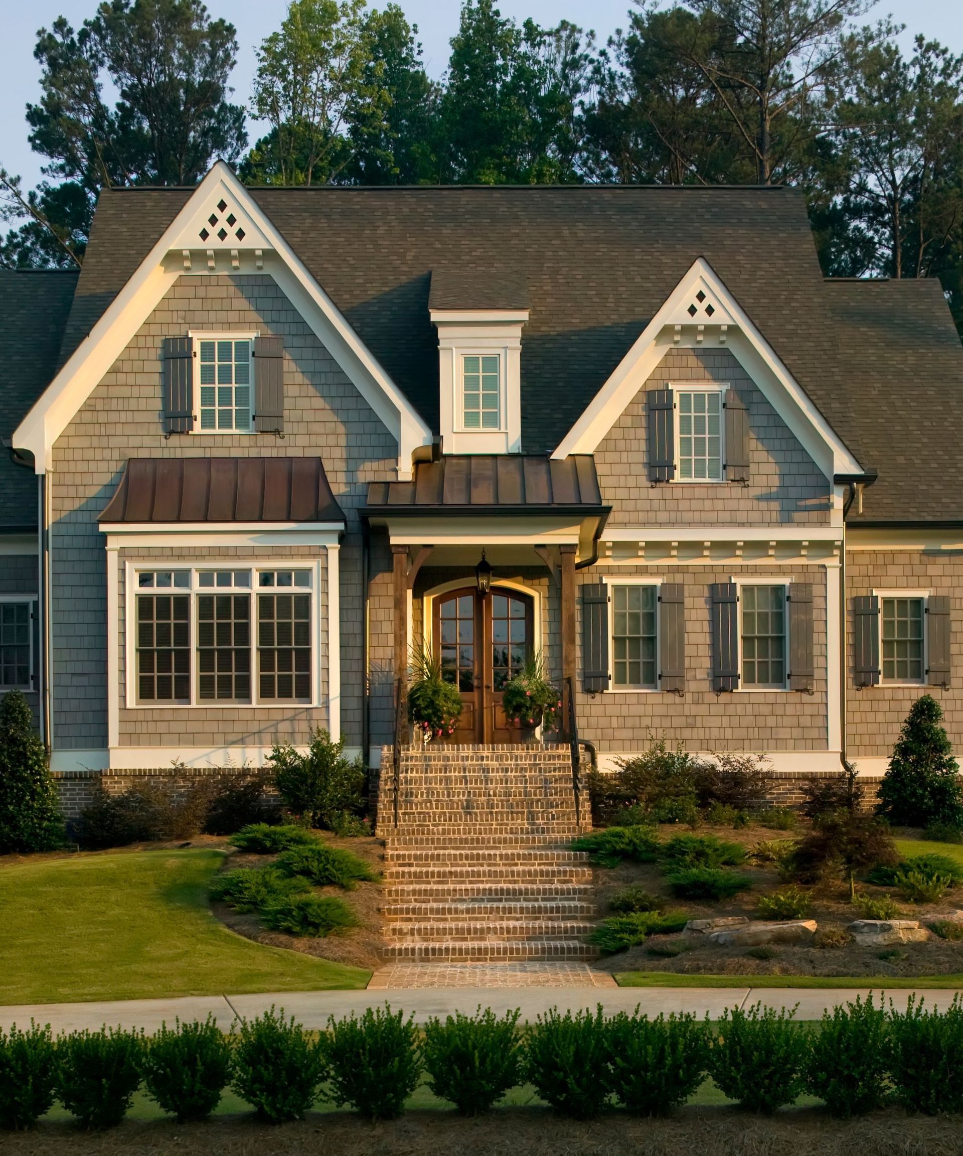 A metal roof on a large American suburban home.