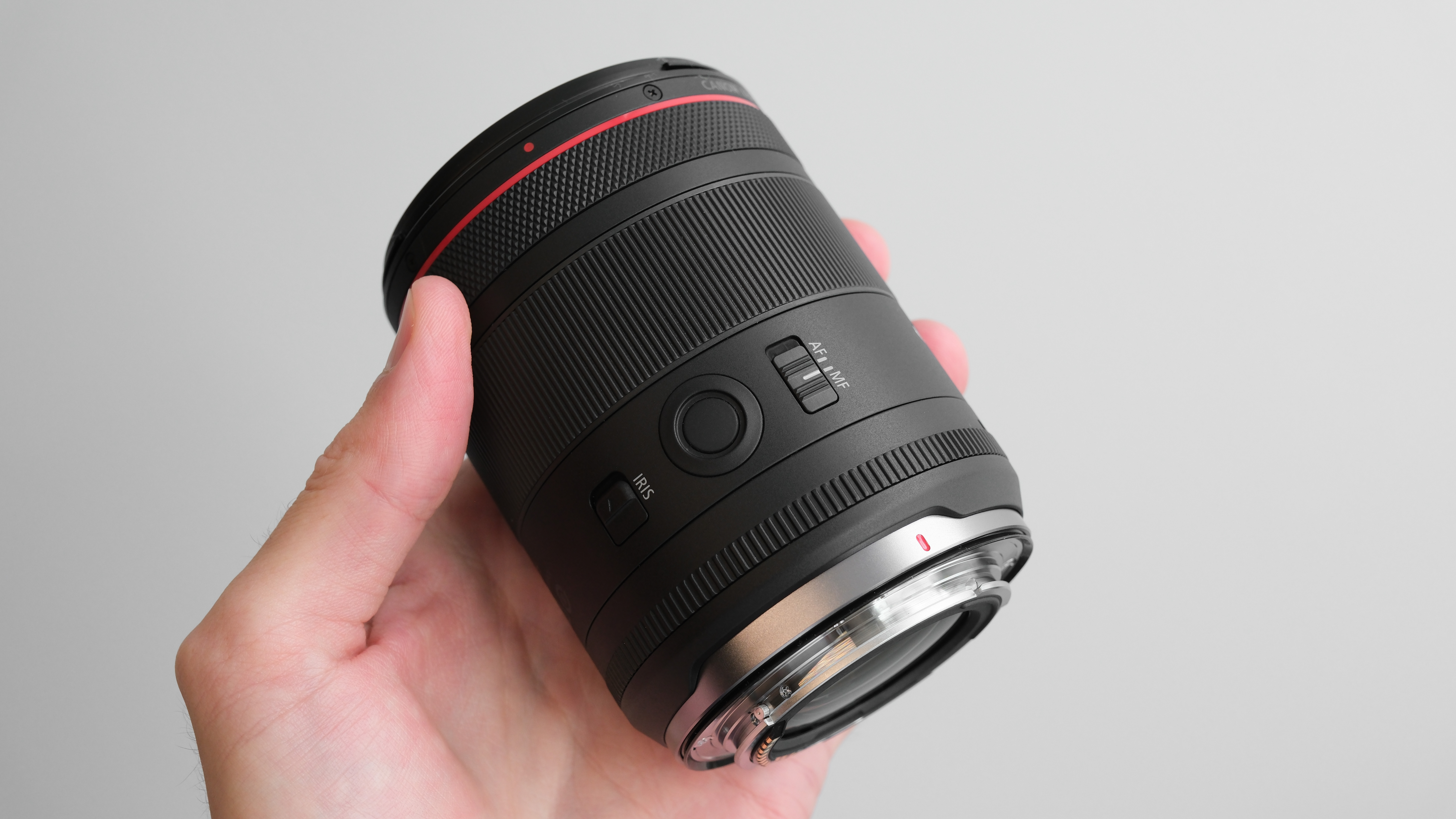 Canon RF 85mm f/1.4L VCM held in hand